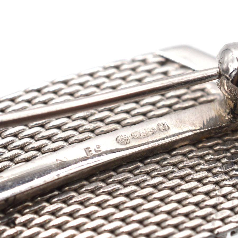 Close-up of Mid Century silver buckle brooch with marcasites, showcasing intricate details and hallmark.