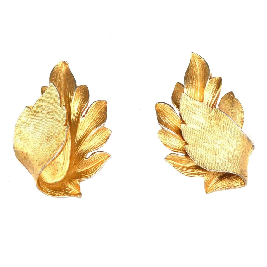 Mid Century Trifari gilt metal leaf earrings in baroque style, ideal for dramatic statement at events.