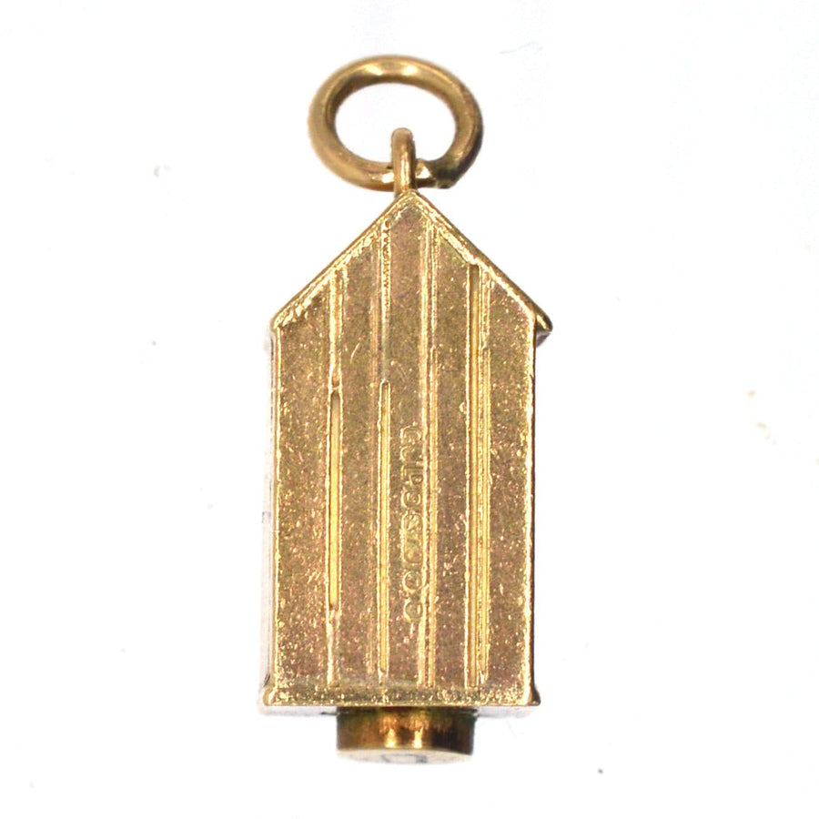 Miniature gold sentry box charm inspired by the Queen's Life Guard, designed by Georg Jensen Ltd.