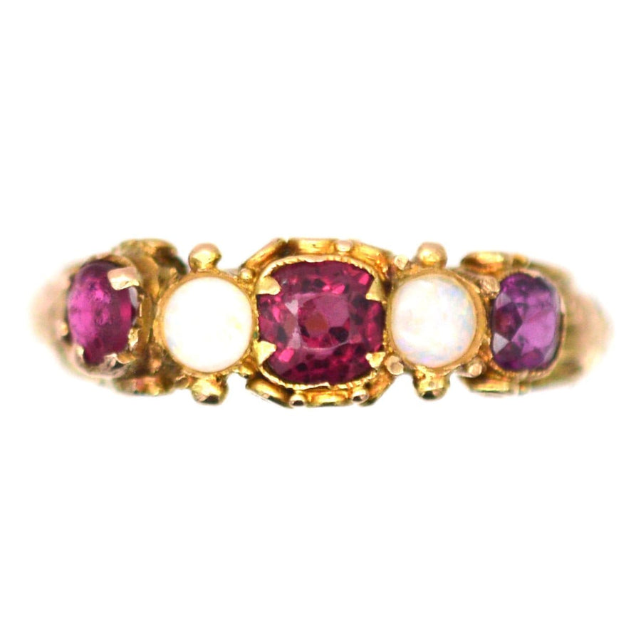 Regency 15ct gold ring featuring garnets and opals in an intricate five stone design, a stunning piece for any collection.