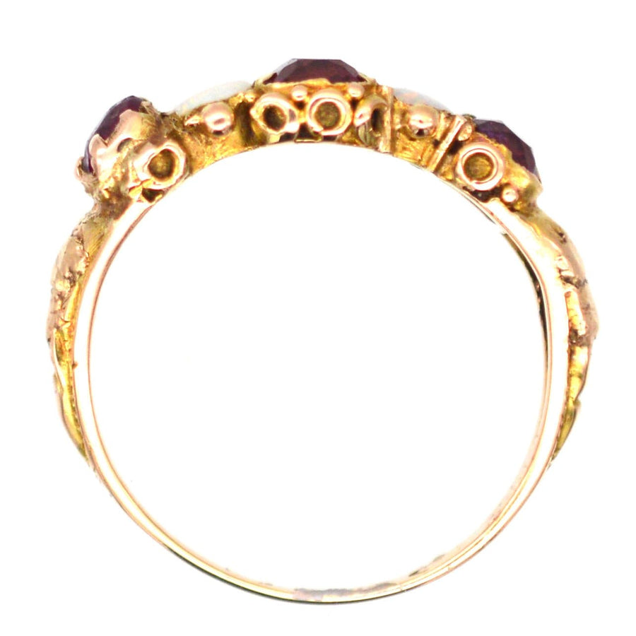 Regency 15ct gold five stone ring featuring garnets and opals, perfect for engagement or jewelry collection.