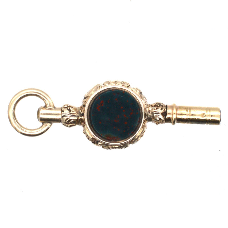 Regency gold cased watch key featuring bloodstone and amethyst paste, elegant vintage pendant from the 1820s.