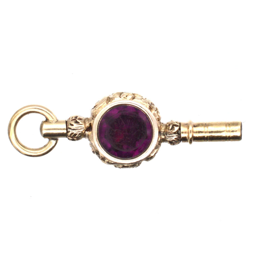 Regency gold cased watch key featuring amethyst paste, elegant vintage pendant from the 1820s.