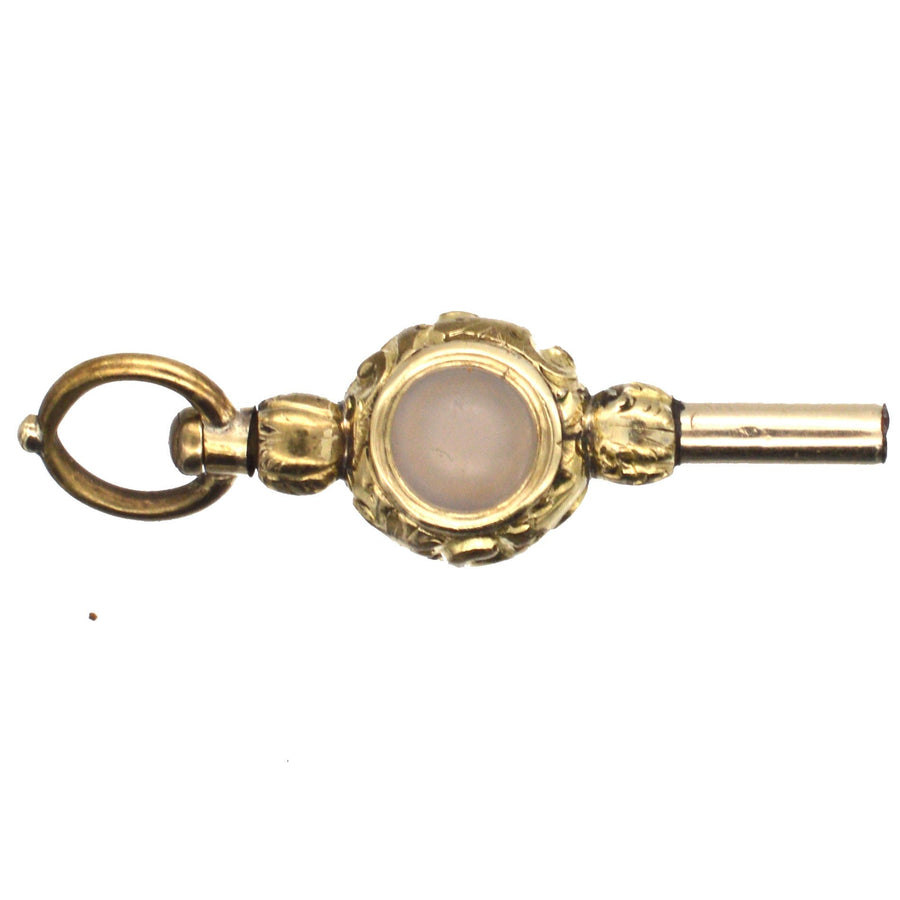 Regency gold cased watch key with carnelian and white chalcedony, elegant pendant design.