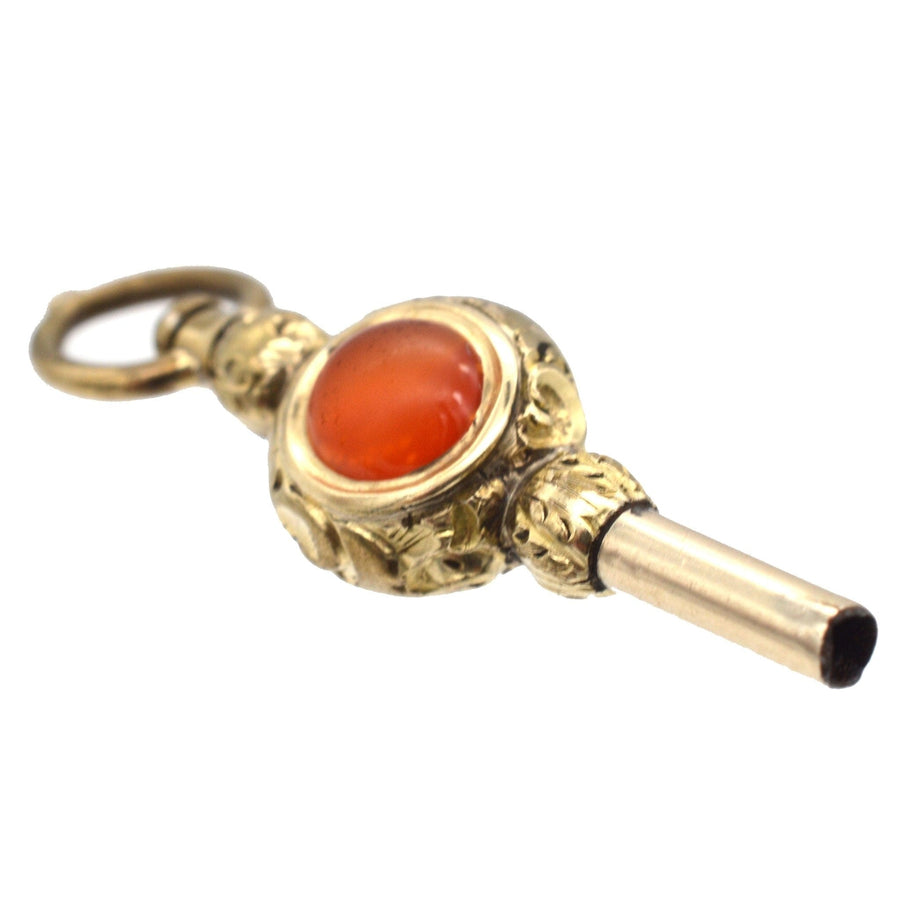 Regency gold cased watch key with carnelian and white chalcedony, elegant pendant with intricate design.