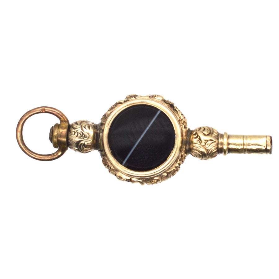 Regency gold cased watch key featuring banded onyx and agate, adorned with an intaglio rose design.