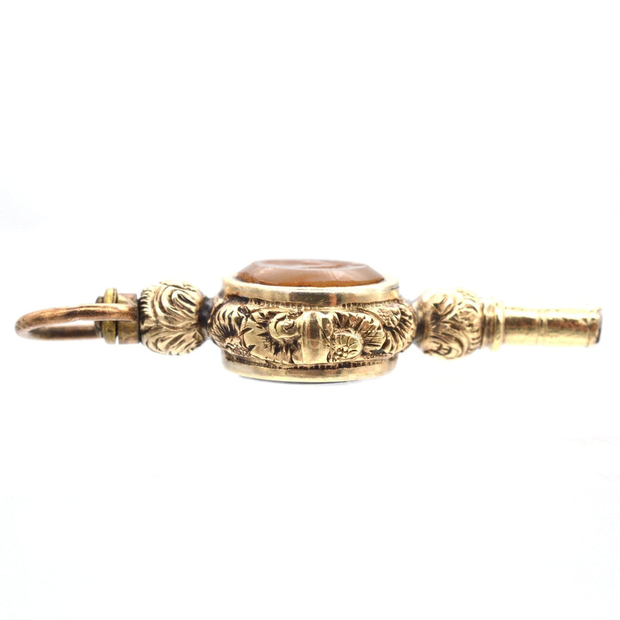 Regency gold cased watch key featuring banded onyx, agate, and intaglio rose design from the 1820s.