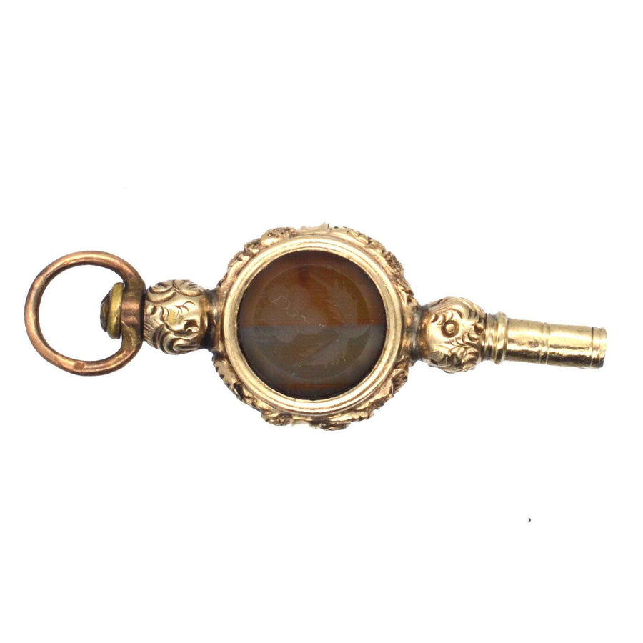 Regency gold cased watch key with banded onyx and agate featuring rose intaglio, dating to 1820s, perfect for pendants.