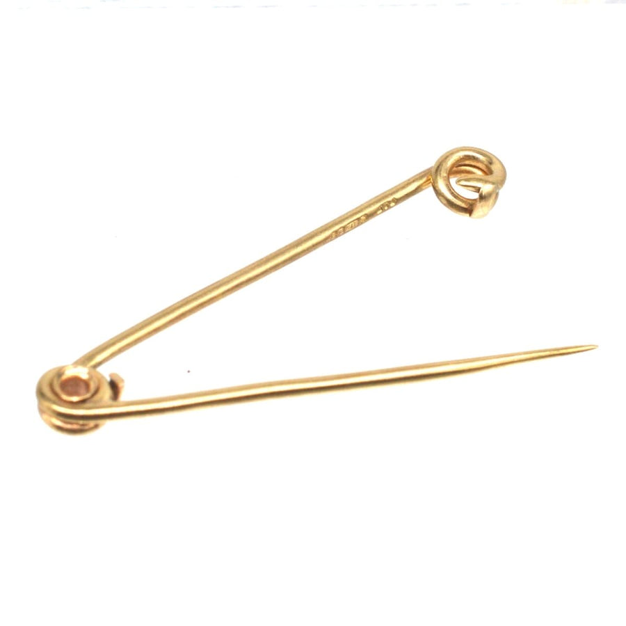 Vintage 9ct gold safety pin brooch by Cropp and Farr, a functional and decorative piece of historical significance.