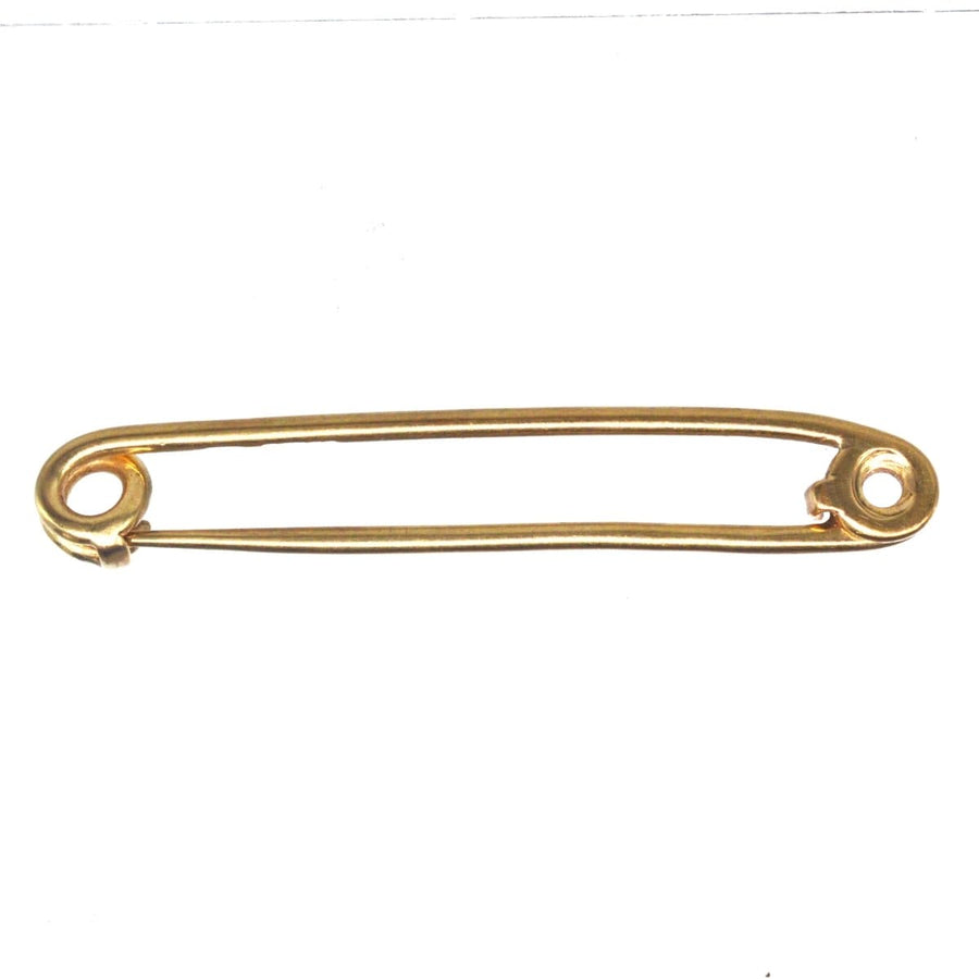 Vintage 9ct gold stock safety pin brooch, a classic piece of British equestrian fashion.