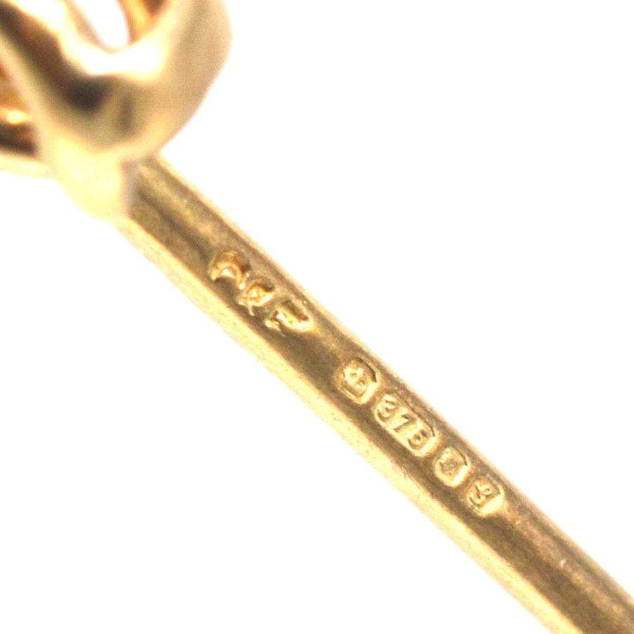 Close-up of hallmark on vintage 9ct gold stock pin brooch by Cropp and Farr, showcasing craftsmanship and authenticity.