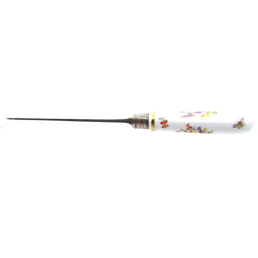 Thomas Goode silver carving fork with painted Meissen porcelain handle, late 19th century collectible.