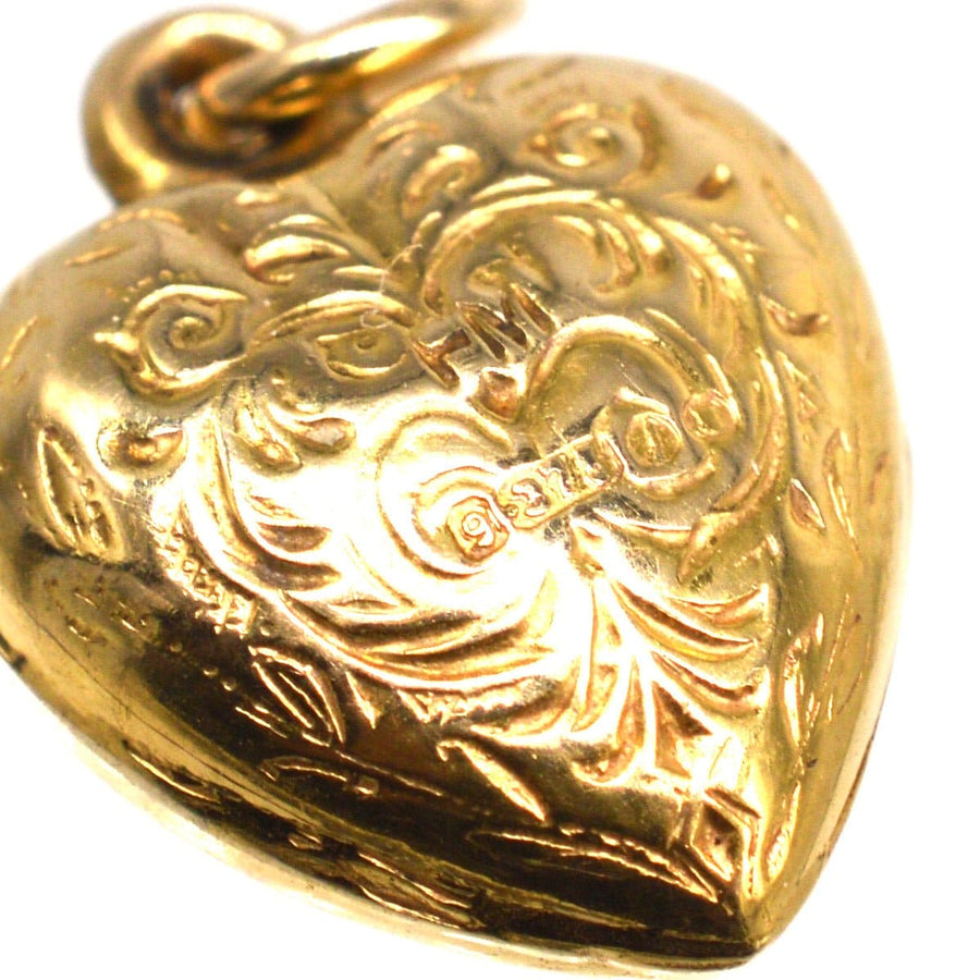1960s 9ct gold puffy heart pendant charm featuring intricate scroll designs, perfect for a bracelet or necklace.