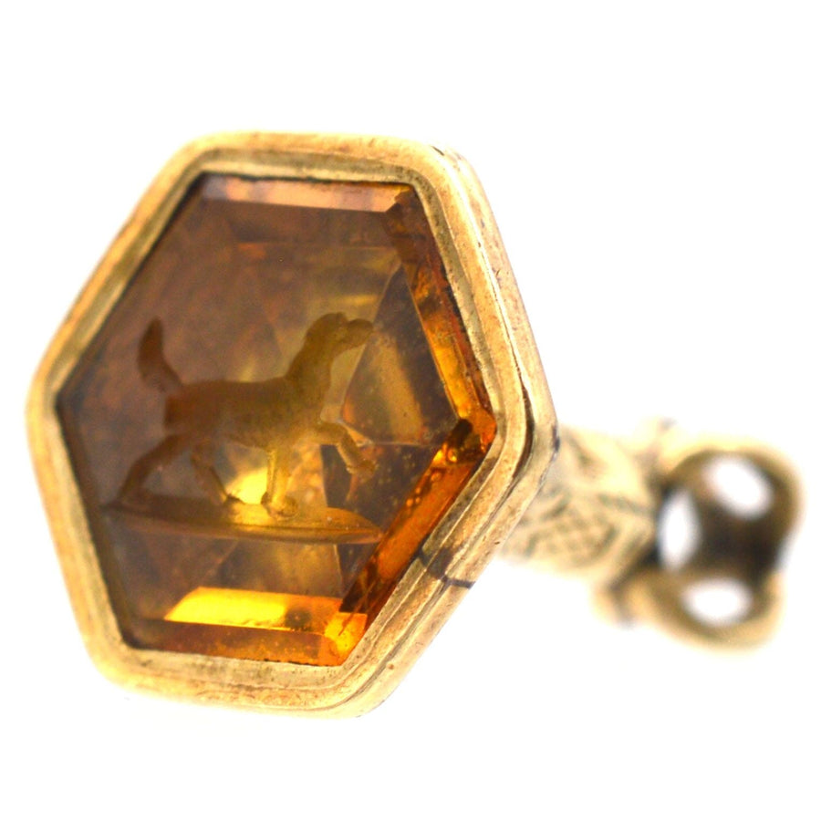 Tiny Victorian 9ct gold hexagonal citrine seal with intaglio dog design, circa 1830s-1840s.