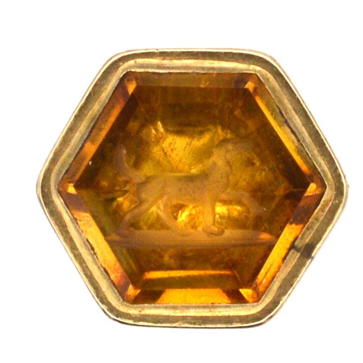 Vintage hexagonal citrine seal featuring an intaglio engraving of a dog, from the Early Victorian era.