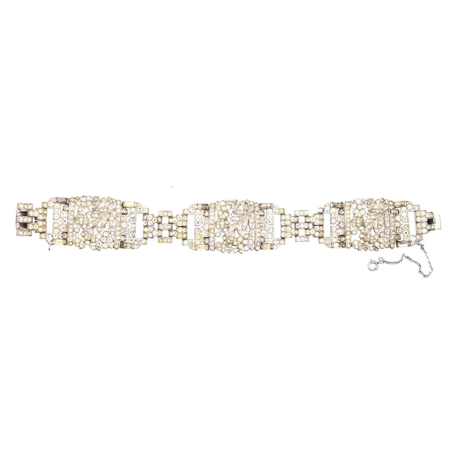 Trifari 1940s silver-tone wide bracelet with white paste, inspired by vintage royal jewelry, a sparkling conversation starter.