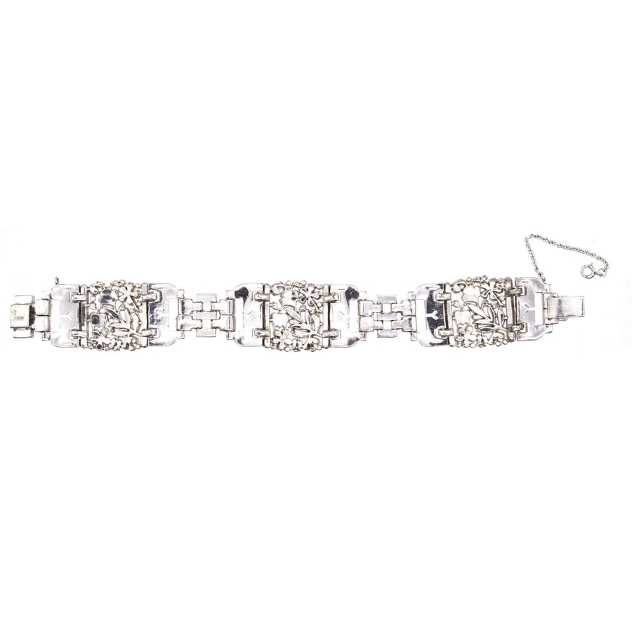 Trifari 1940s silver-tone wide bracelet with white paste gemstones, inspired by vintage elegance.