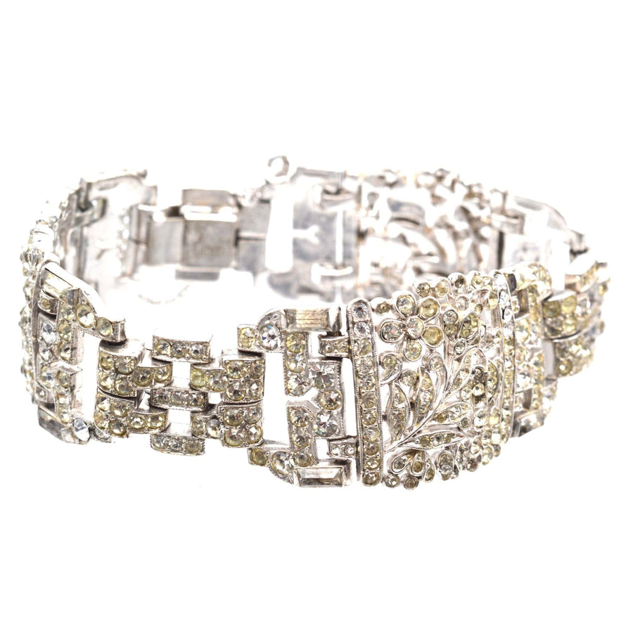 1940s Trifari silver-tone wide bracelet with white paste stones, emulating classic vintage elegance.