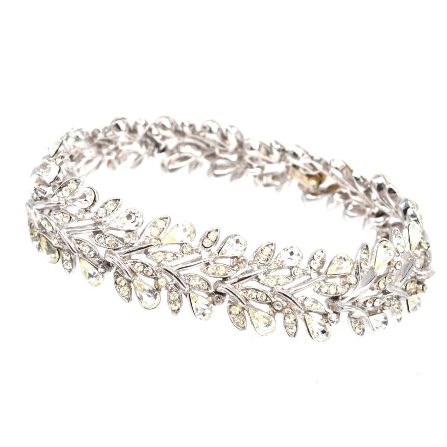 Trifari 1950s white diamond paste bracelet designed as a floral wreath with sparkling stones.
