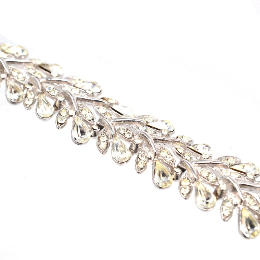 Trifari 1950s white diamond paste bracelet with floral wreath design and shimmering stones.