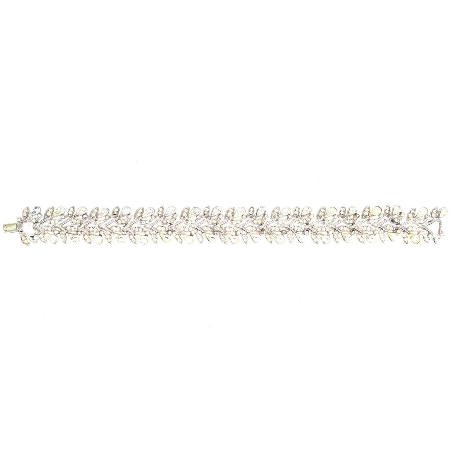 Trifari 1950s vintage floral wreath bracelet featuring white diamond paste stones, elegant and collectible jewelry.