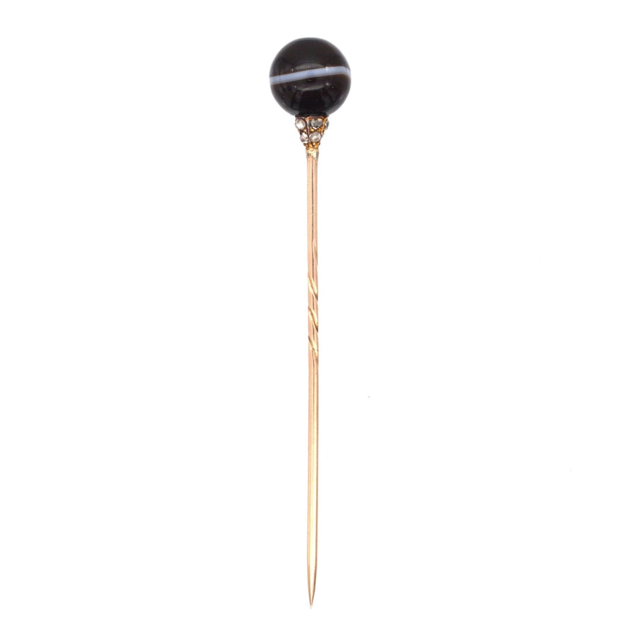 Victorian 15ct gold tie pin with banded onyx sphere and diamond studded mount for elegant outfits.