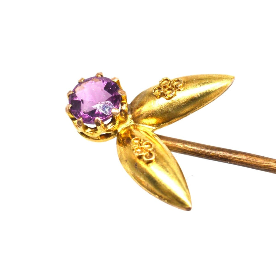 Victorian 15ct gold Etruscan Revival tie pin with amethyst, showcasing intricate granulation and filigree details.