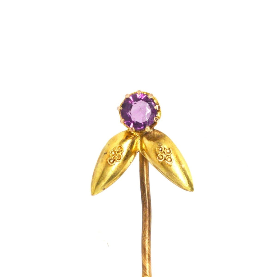 Victorian 15ct gold Etruscan Revival tie pin featuring amethyst and intricate gold leaf detailing.