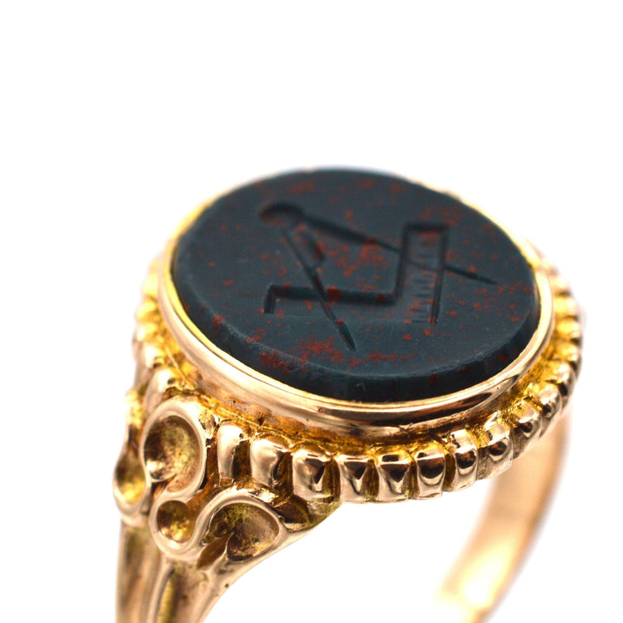 Victorian 15ct gold signet ring featuring engraved bloodstone and Masonic emblem, Birmingham 1866.