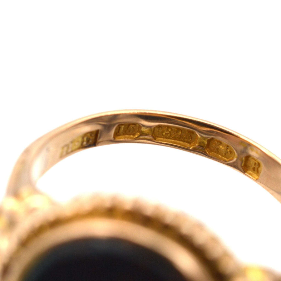 Close-up of the inner band of a Victorian 15ct gold signet ring with assay marks from 1866.
