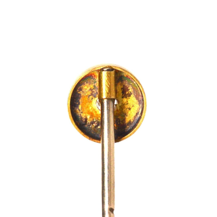Victorian gold tie pin featuring an old mine cut diamond in a star setting, showcasing classic elegance.