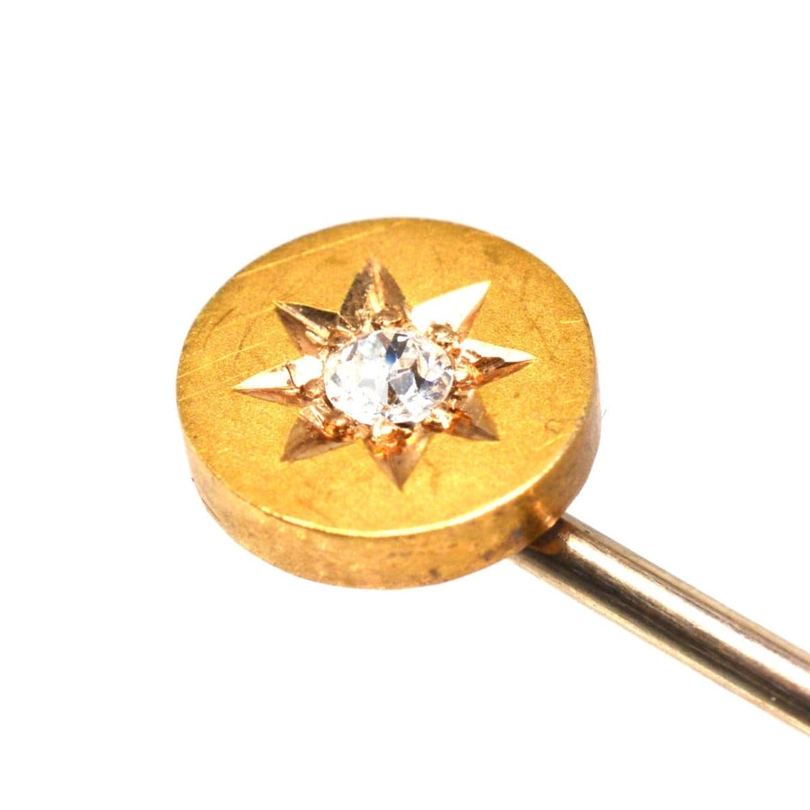 Victorian 15ct gold stickpin featuring an old mine cut diamond in a star-shaped setting.