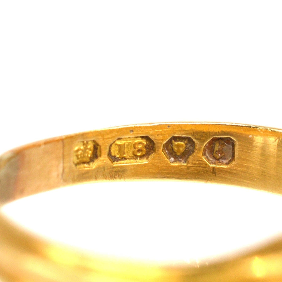 Close-up of 18ct gold hallmark on Victorian signet ring, showcasing its exquisite craftsmanship and authenticity.