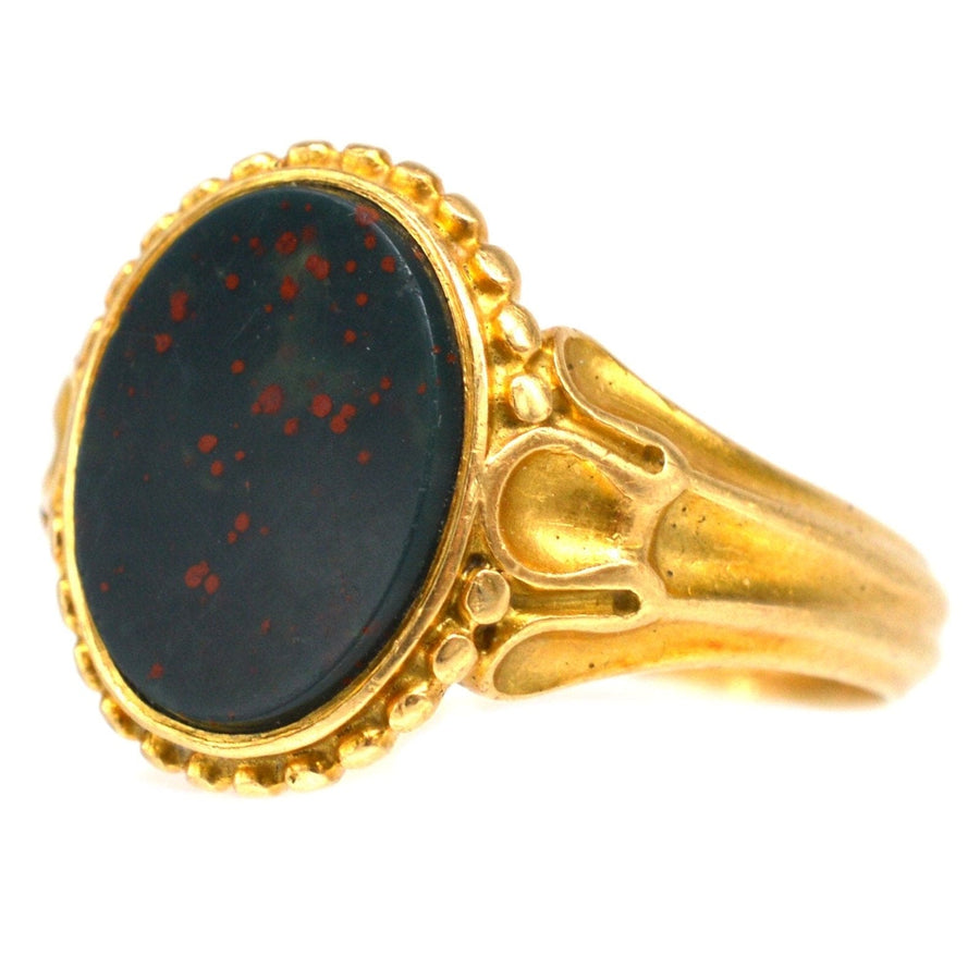Victorian 18ct gold bloodstone signet ring with decorated shoulders, assayed in London, 1858.