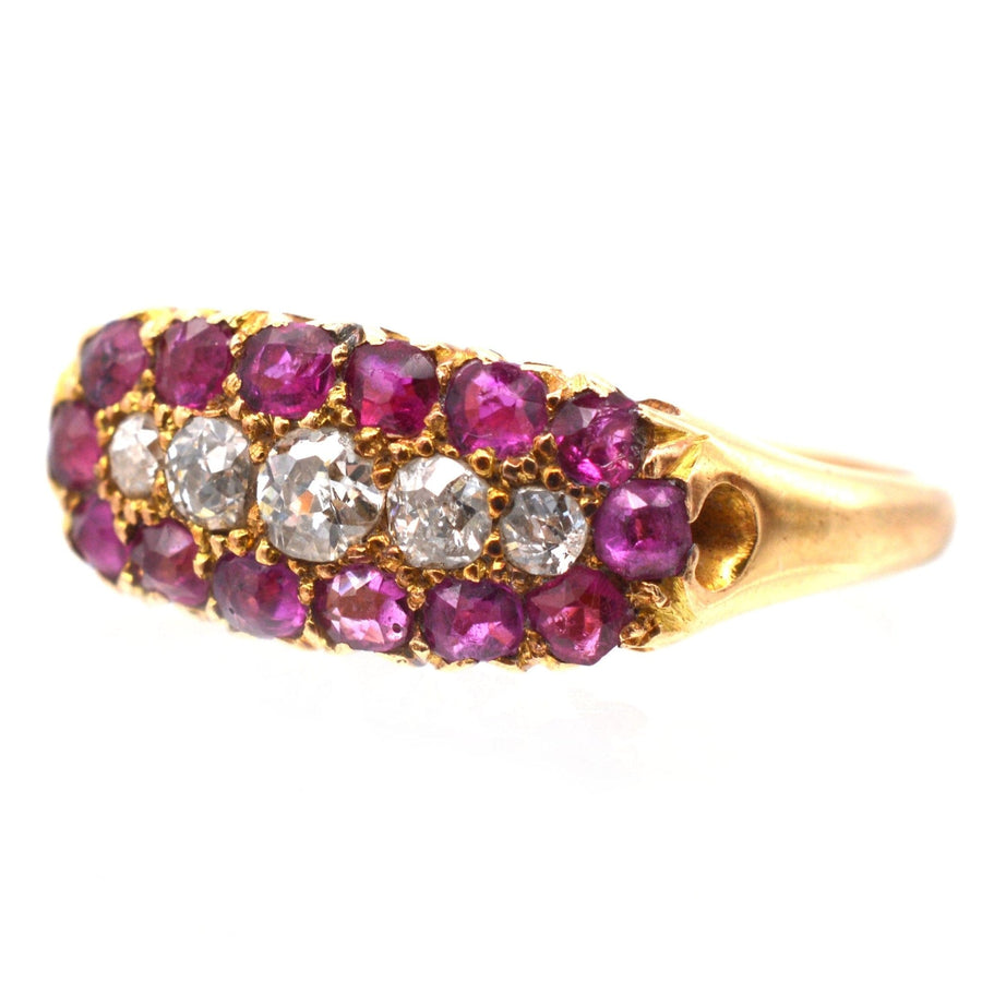 Victorian 18ct gold boat-shaped ring featuring five diamonds and a ruby cluster, perfect for engagements or gifts.