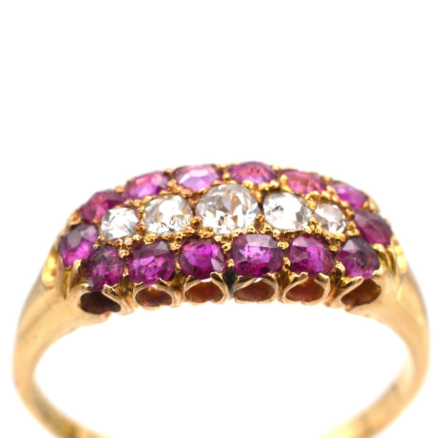 Victorian 18ct gold boat-shaped ring featuring five diamond and ruby cluster stones, ideal as an engagement ring.