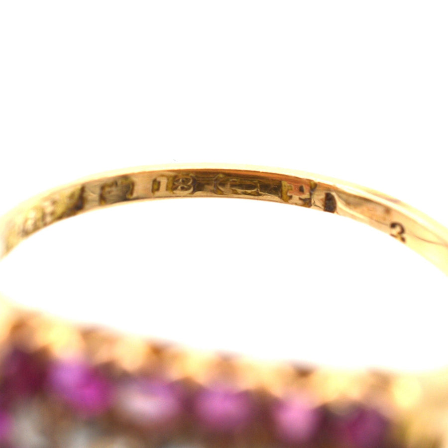 Close-up of the hallmark on a Victorian 18ct gold ruby and diamond cluster ring made in Birmingham in 1889.
