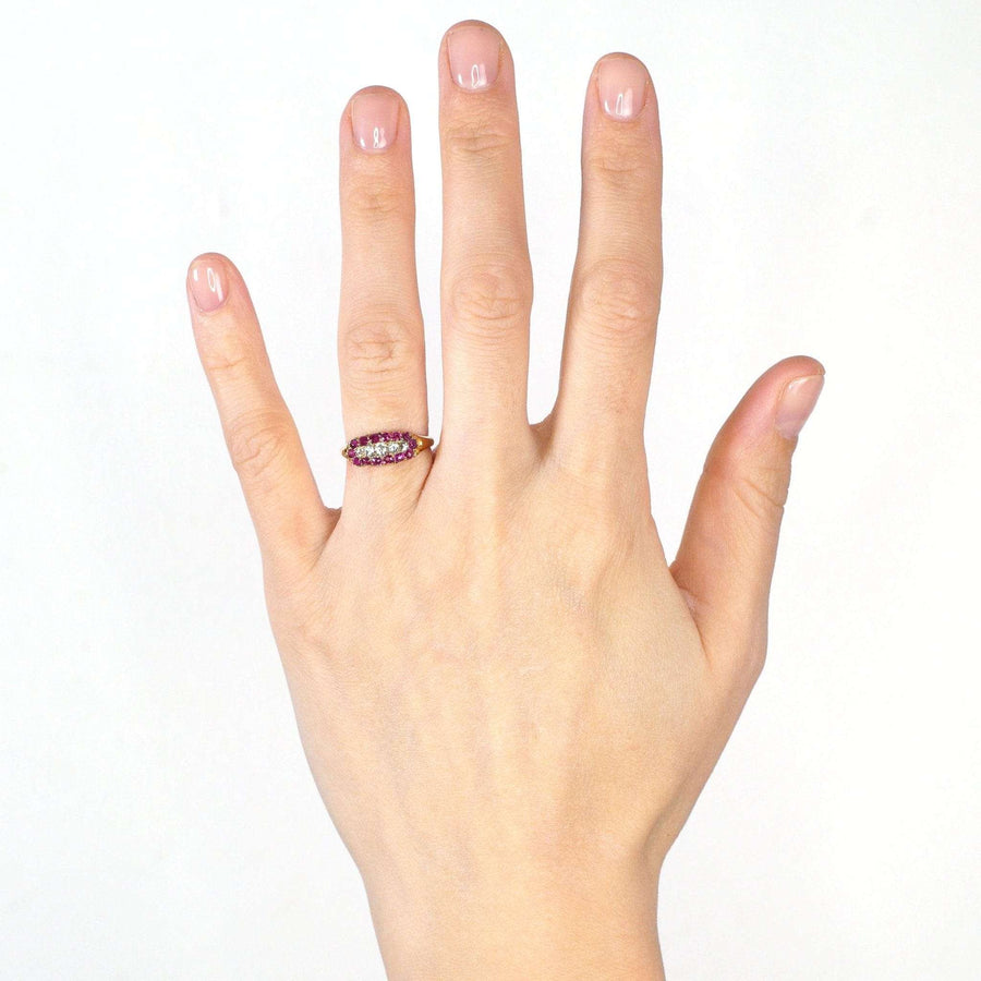 Victorian 18ct gold five stone diamond and ruby cluster ring worn on hand, ideal for engagement or special gift.