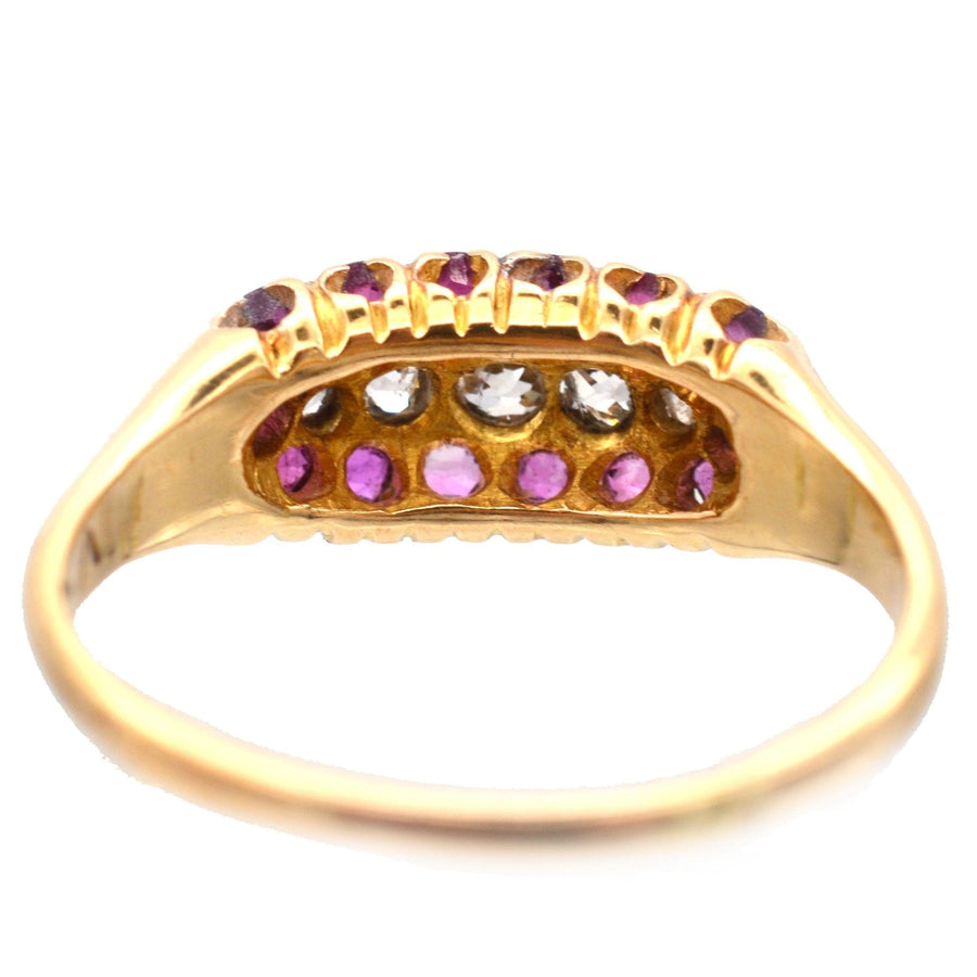Victorian 18ct gold boat-shaped ring featuring five diamonds and ruby cluster, made in Birmingham 1889.