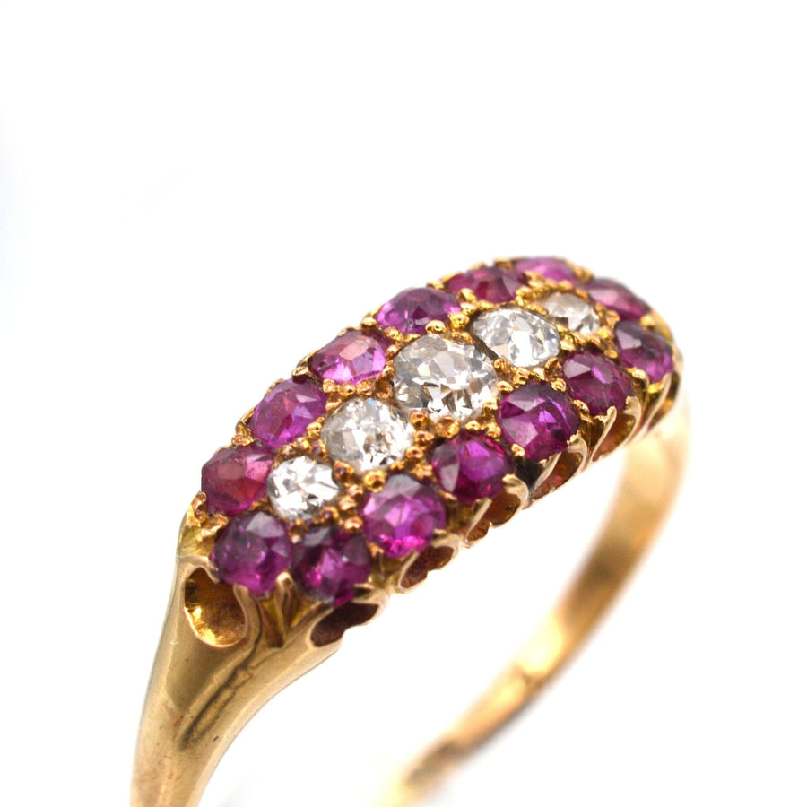 Victorian 18ct gold boat-shaped ring featuring five stone diamond and ruby cluster design, crafted in 1889.