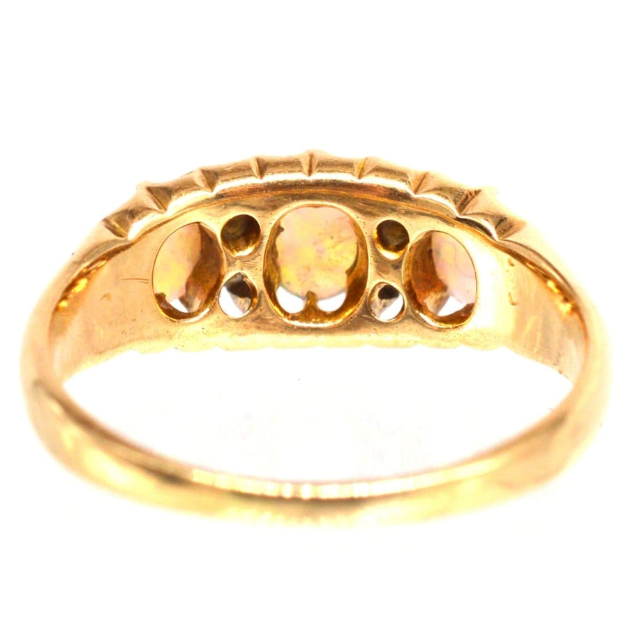 Victorian 18ct gold opal and diamond ring, made in 1875, featuring colorful opals and sparkling diamonds.