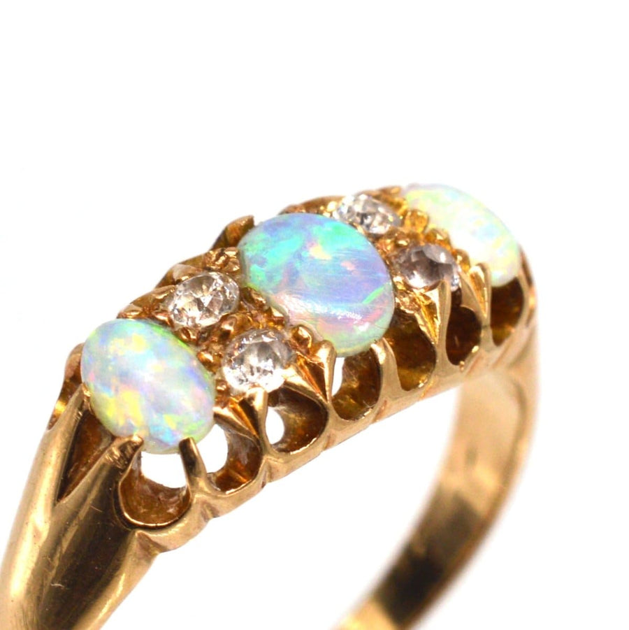 Victorian 18ct gold opal and diamond ring, featuring colorful opals and sparkling diamonds, made in Birmingham, 1875.