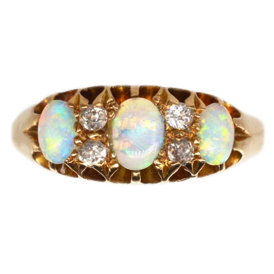 Victorian 18ct gold ring featuring colorful opals and diamonds, crafted in Birmingham, 1875, ideal for engagement or October birthdays.