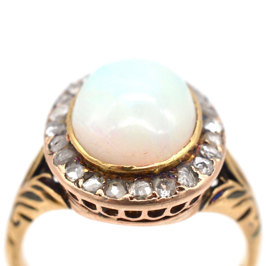 Victorian 18ct gold ring featuring a milky green opal surrounded by rose diamonds, elegant cluster design.
