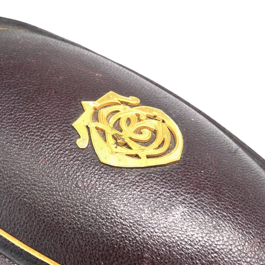 Gold monogram detail on the original case of a Victorian turquoise pavé locket.
