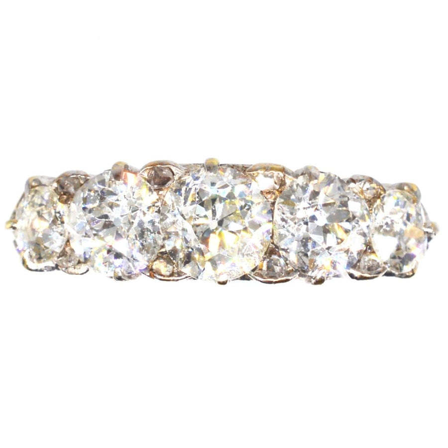 Victorian 2.2 Carat Five Stone Diamond Carved Half Hoop Ring with brilliant diamonds creating a sparkling effect.