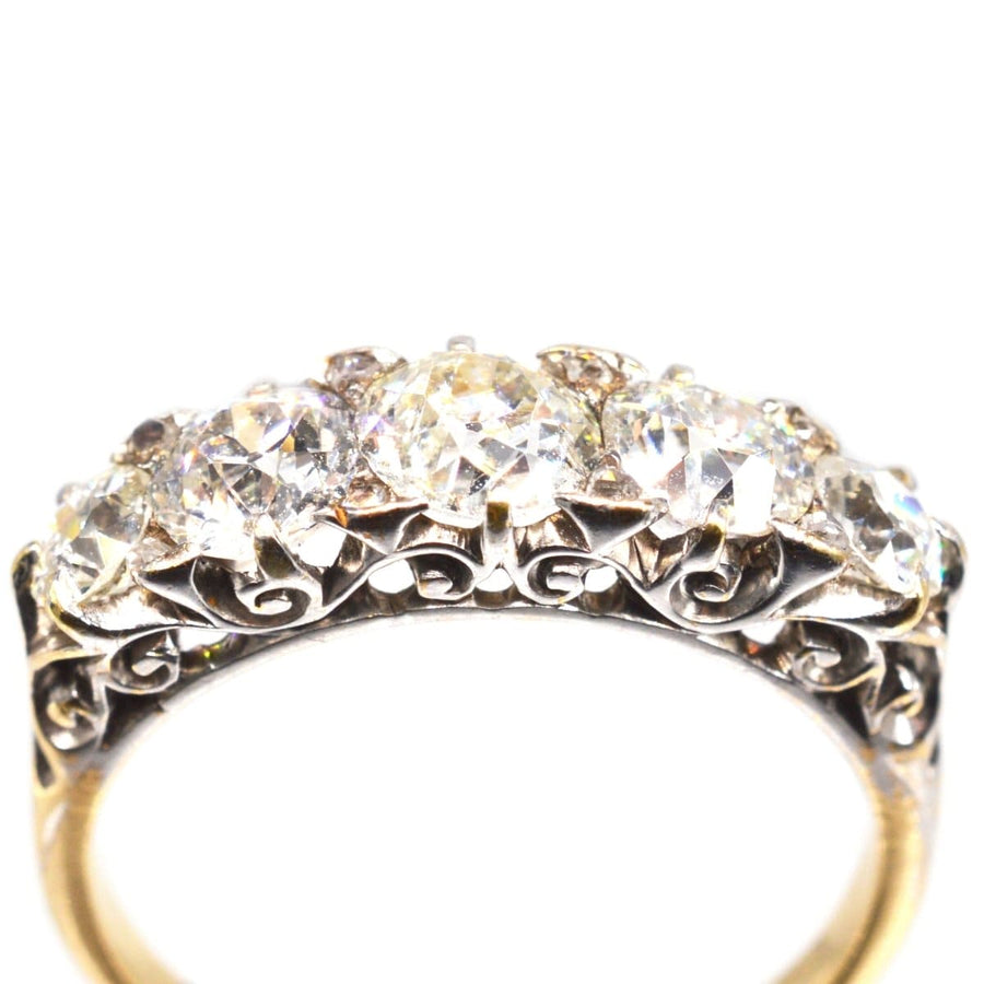 Victorian 2.2 carat five stone diamond carved half hoop ring showcasing sparkling diamonds and intricate design.