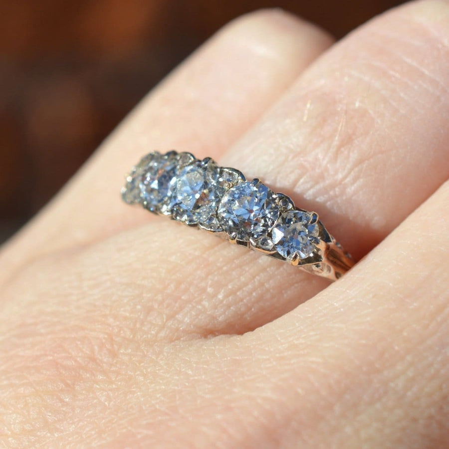 Victorian 2.2 carat five stone diamond carved half hoop ring, showcasing sparkling diamonds set in a gold band.