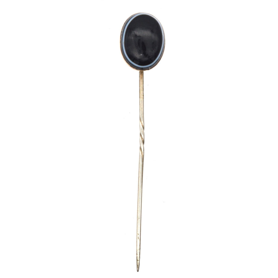 Victorian 9ct gold tie pin featuring large oval black onyx with white band, 1860s-1880s craftsmanship.