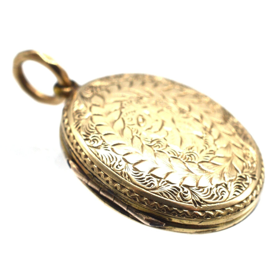Victorian 9ct gold floral locket featuring intricate rose design and shield with ivy, perfect for holding precious memories.